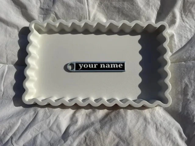 Front of a personalised bag tag